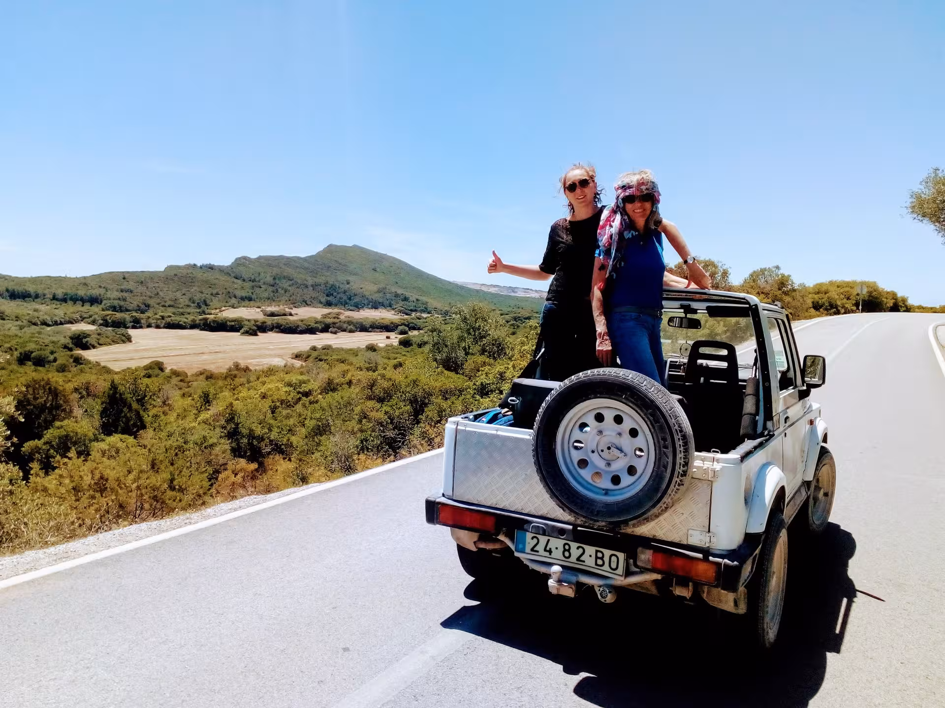 Guests riding a 4x4 jeep with mountain views on the Arrábida Safari Tour, exploring Setúbal nature and scenery