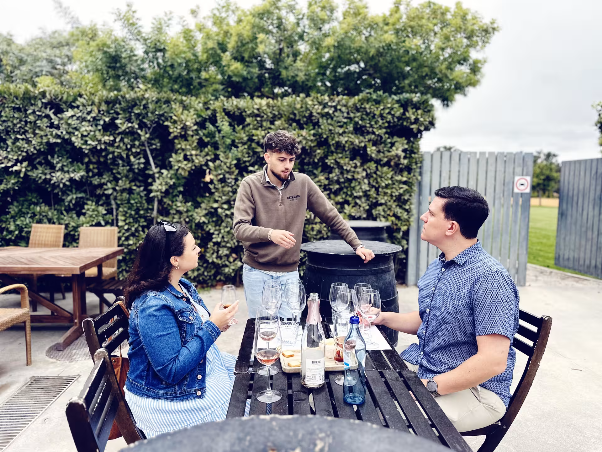 Private Arrábida wine tour tasting with guide, sampling local wines and food pairings on winery terrace