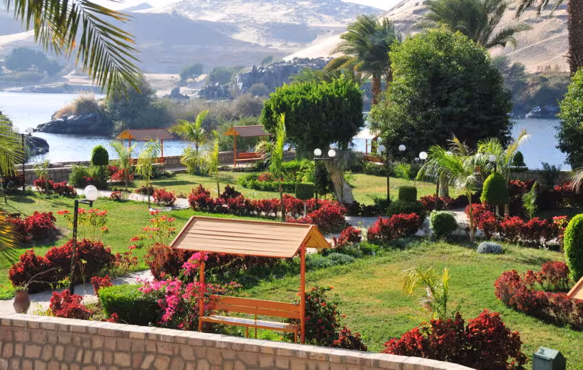 Colorful flowerbeds and gazebos overlooking the Nile at Aswan Botanical Garden, Kitchener Island excursion