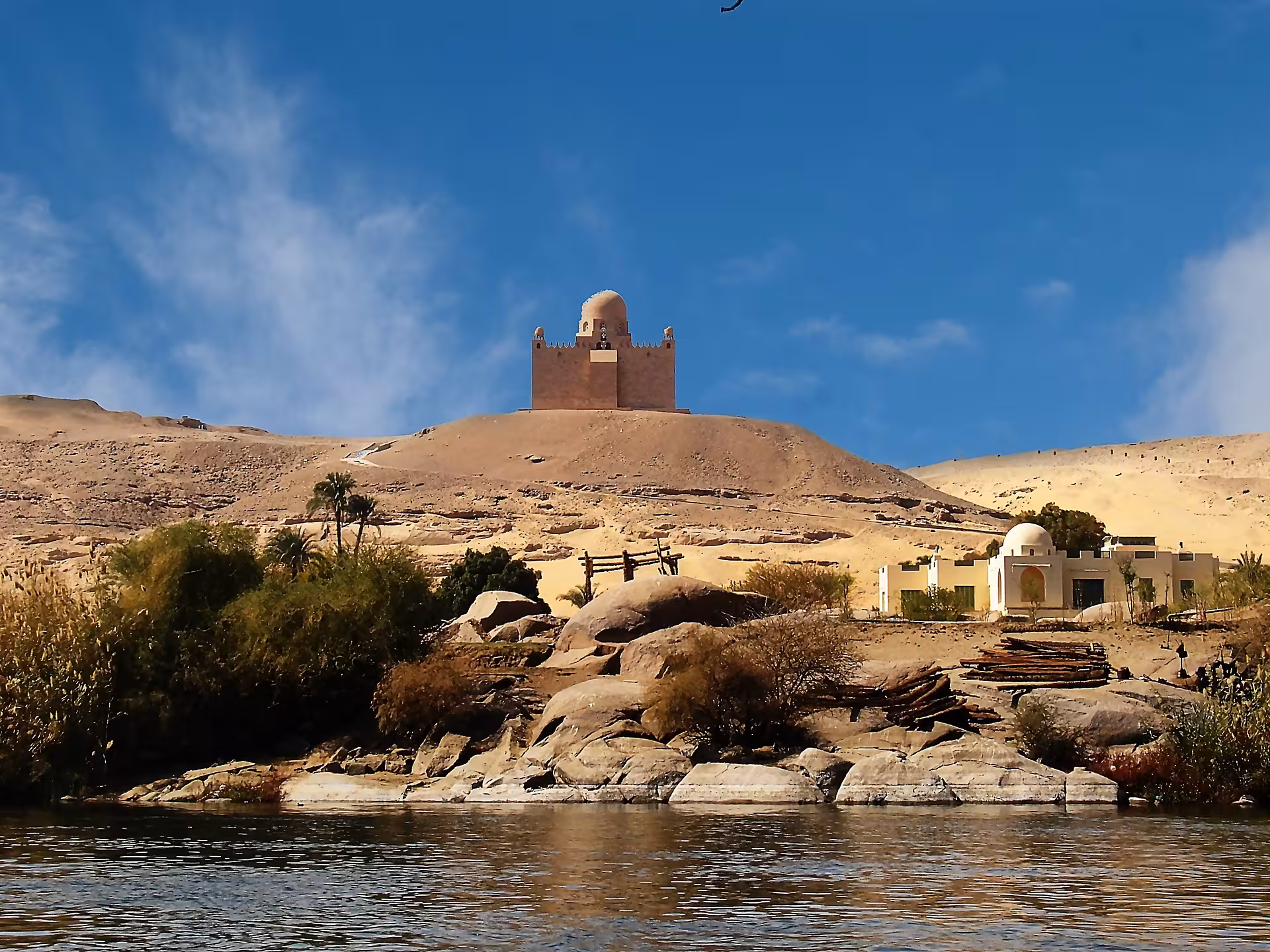 Mausoleum of Aga Khan on sandy hill above Nile River banks in Aswan, Egypt