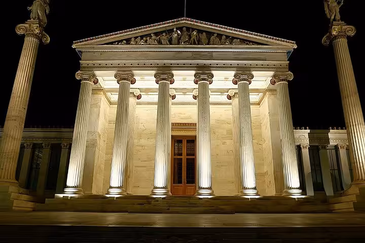 Illuminated Academy of Athens at night, elegant stop on Athens private luxury Acropolis half-day tour