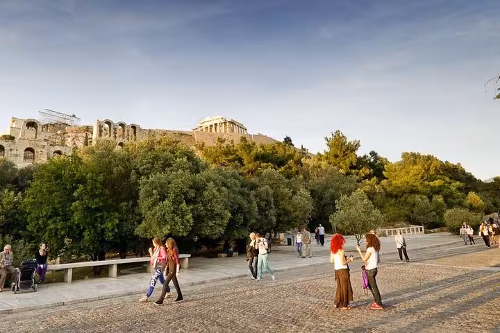 Visitors strolling below the Acropolis in Athens, scenic viewpoint on a private full-day city tour