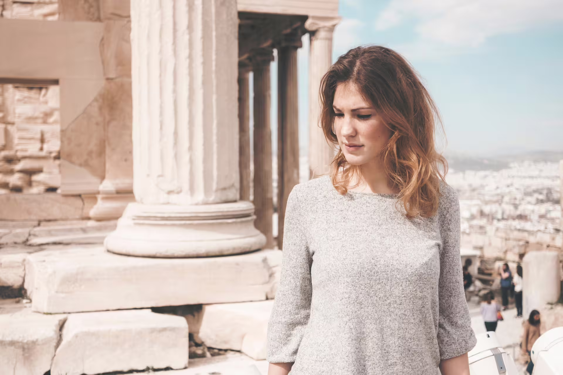 Traveler at Acropolis columns in Athens, scenic viewpoint on a classical full-day private tour experience