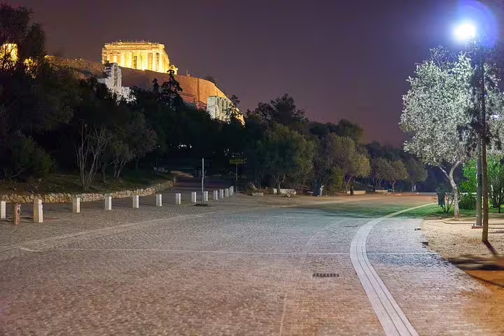 Night view of the Acropolis and Parthenon from Dionysiou Areopagitou walkway, part of Athens tour with skip-the-line entry