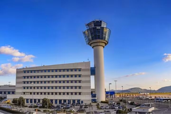 Athens International Airport control tower exterior, destination for Lavrio Port private departure transfer