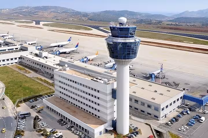 Aerial view of Athens International Airport control tower, ideal for luxury private transfer to Athens hotels