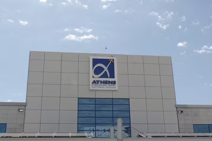 Athens International Airport entrance sign, reliable Lavrio port or hotel to ATH private transfer drop-off