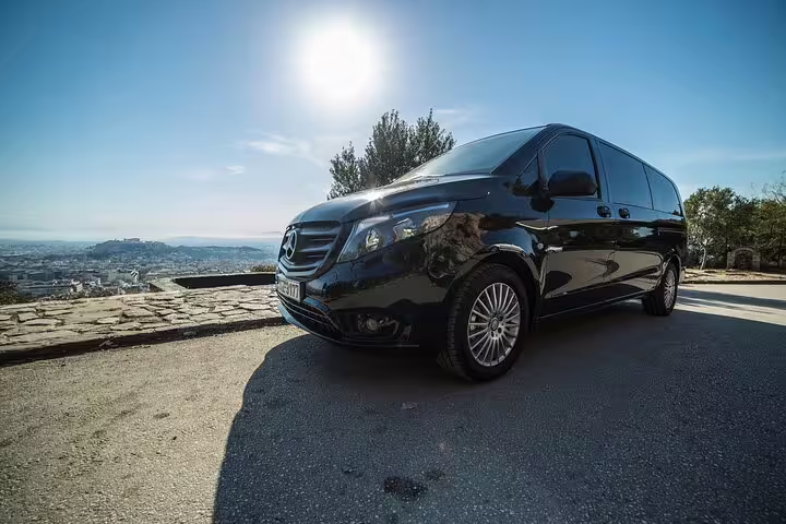 Black Mercedes van for Athens airport to Lavrio port or hotel private transfer with panoramic Athens view