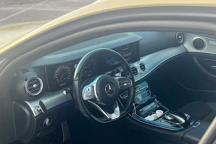 Executive Mercedes cabin for Athens Airport to Piraeus Port private arrival transfer with modern dashboard