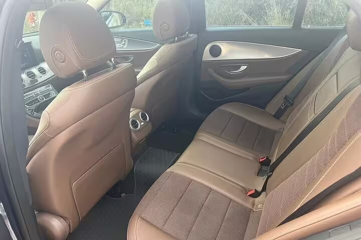 Spacious leather rear seats in private sedan for Athens Airport to Piraeus Port arrival transfer