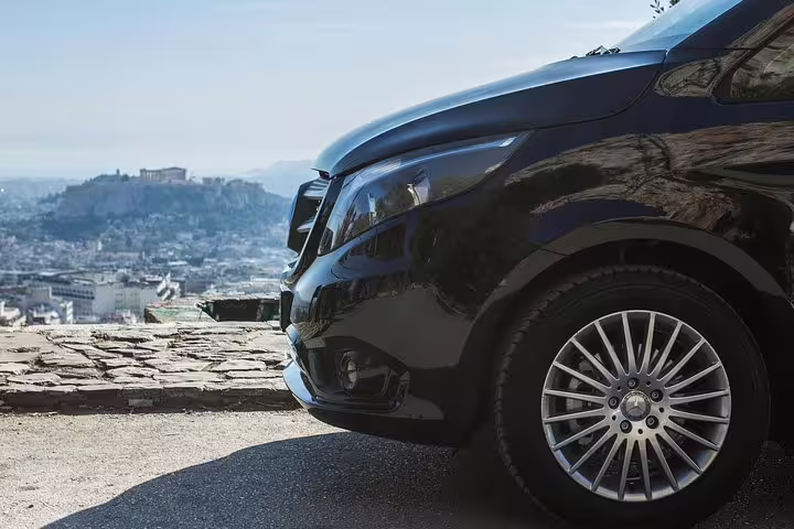 Luxury private transfer van in Athens with Acropolis view, ideal Athens airport to Piraeus port hotel ride