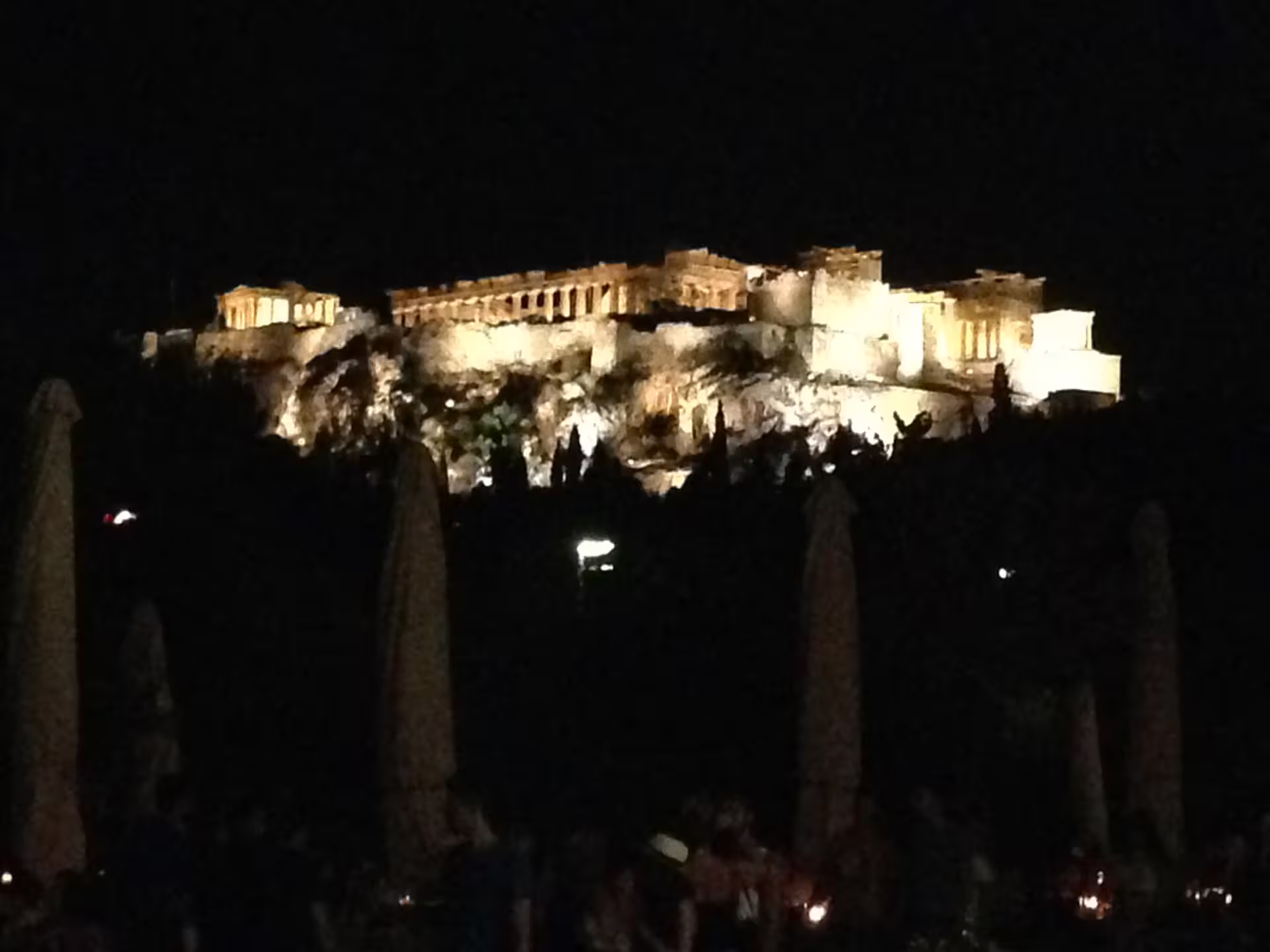 Illuminated Acropolis at night in Athens, a scenic highlight during Athens airport to Piraeus private transfer