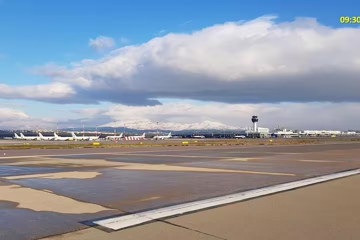 Athens International Airport runway view, meet-and-greet pickup for private transfer from Athens to Igoumenitsa