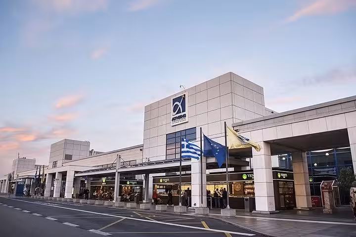 Athens International Airport terminal exterior, meeting point for private luxury transfer to Piraeus Port hotels