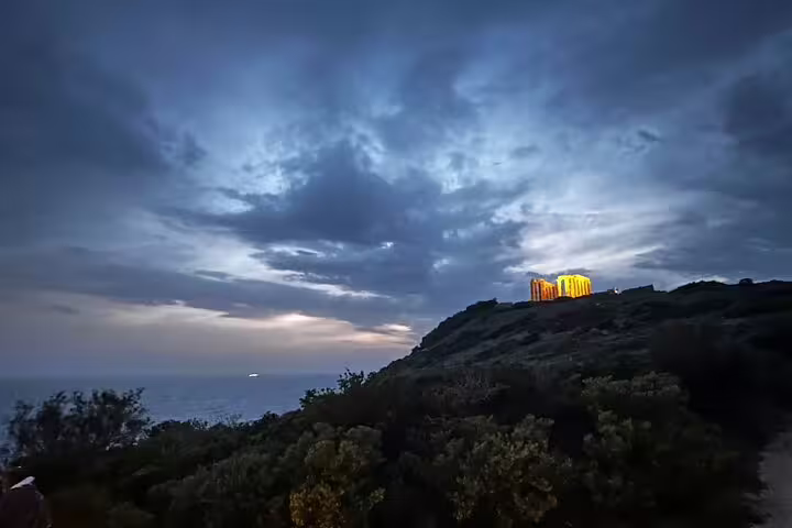 Evening view of Temple of Poseidon at Cape Sounion, ideal add-on after Athens Airport private transfer