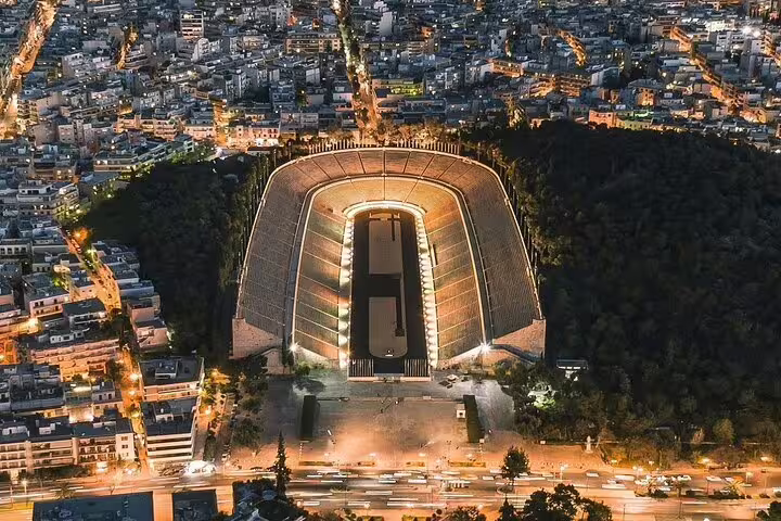 Panathenaic Stadium aerial night view in Athens, Greece, destination highlight on Athens airport to city center transfer