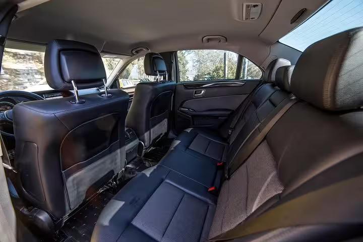Spacious leather rear seats in private car for Athens and Cape Sounio full-day tour, comfortable luxury transfers