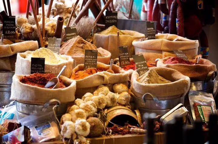 Colorful spice sacks and herbs at Athens Central Market stop on a gourmet small group walking tour with tastings