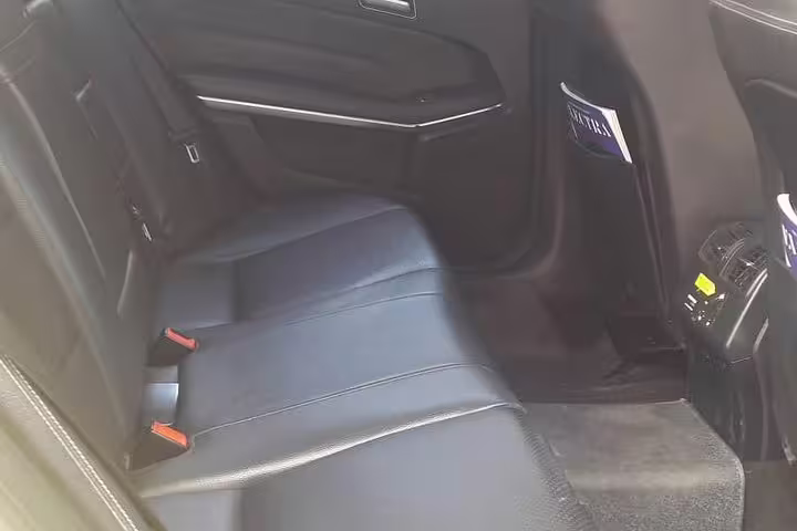 Spacious leather rear seats in private Mercedes for Athens to Delphi transfer, ideal for comfortable day trips