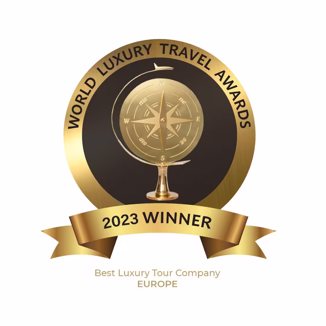 Award emblem for 2023 Best Luxury Tour Company in Europe by World Luxury Travel Awards, highlighting premium Athens symposium tours.