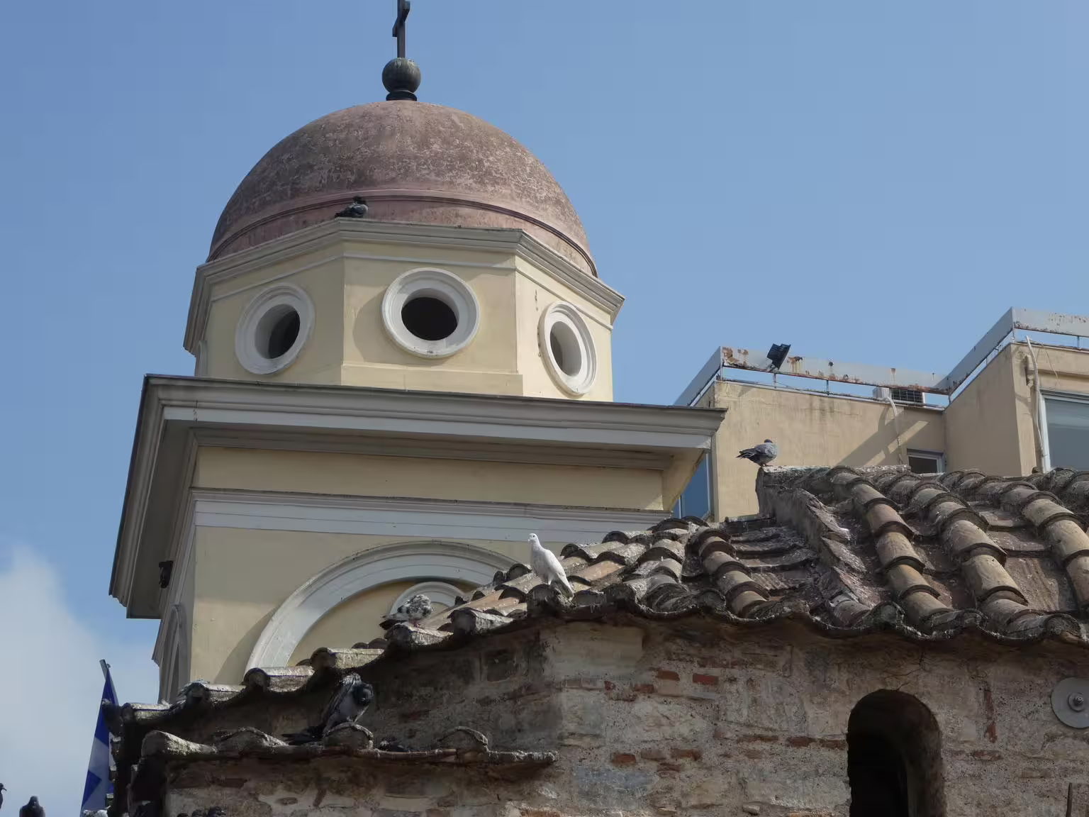 Athens old church dome near Monastiraki market, a stop on a gourmet food walking tour in the city center