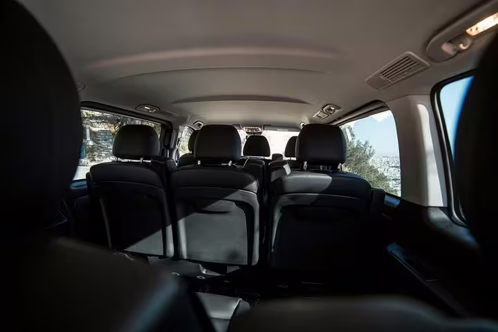 Comfortable multi-seat minivan cabin for private Athens hotel to Piraeus cruise port transfer service
