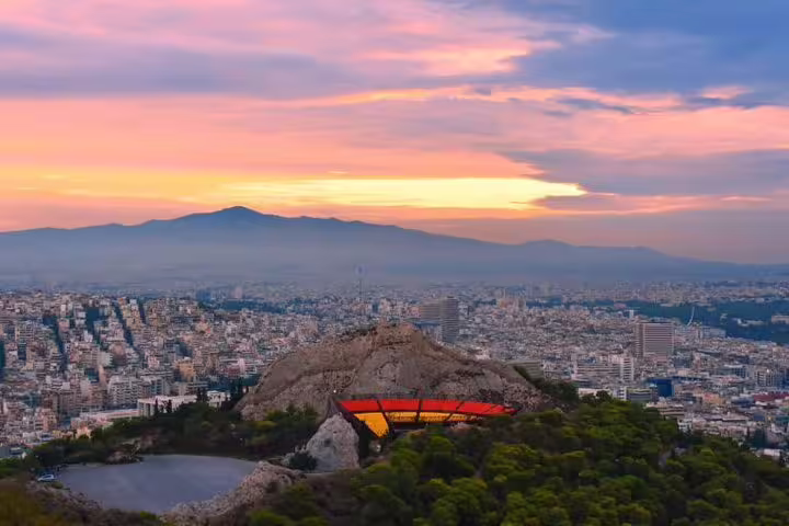 Sunset view over Athens from Lycabettus Hill on a private half-day highlights tour with city panorama