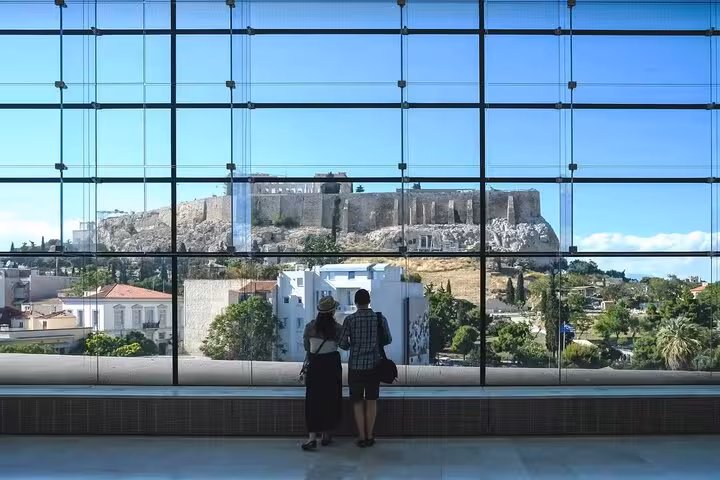 Travelers viewing the Acropolis from Athens airport window, part of 7 days Athens Mykonos Santorini itinerary