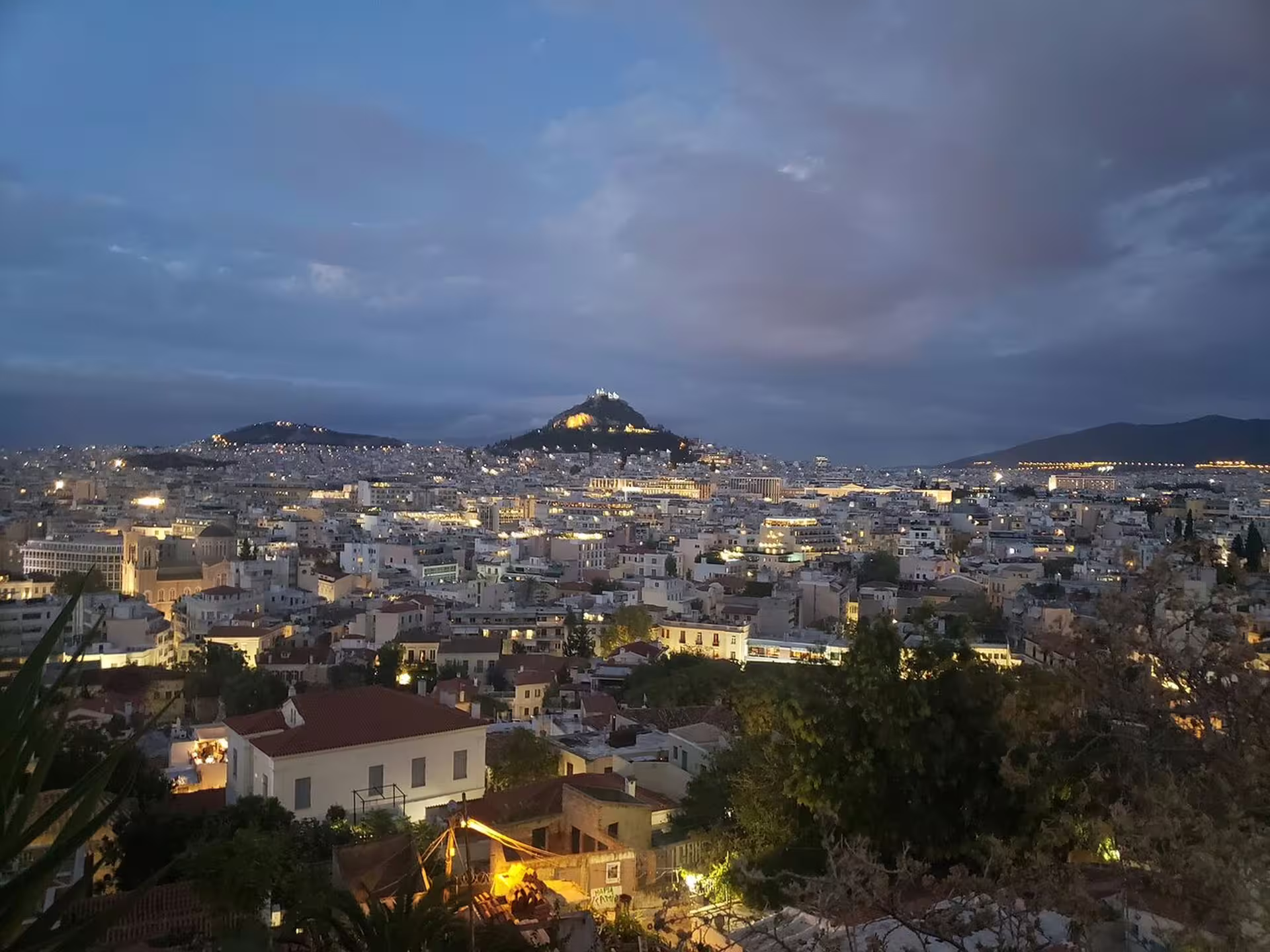 Twilight panorama of Athens city lights from a viewpoint on an Athens at Night small-group walking tour