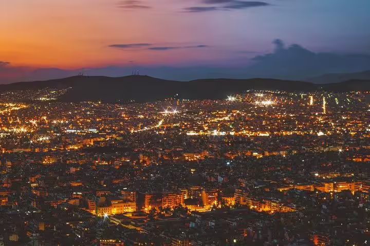 Athens city lights at dusk from a panoramic viewpoint, perfect for an Athens night tour highlights experience