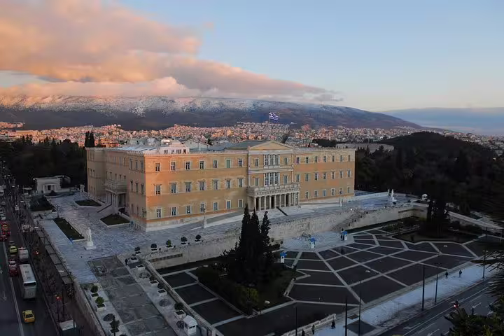 Illuminated Hellenic Parliament in Athens at dusk, a highlight of the Athens at Night walking tour with dinner