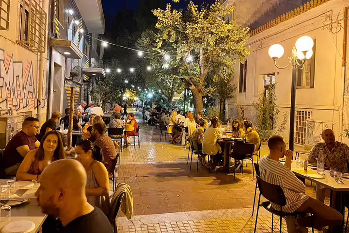 Athens nightlife with outdoor tavernas and string lights, seen on a 2-hour private express highlights tour
