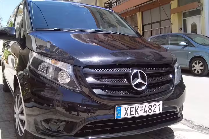 Black Mercedes van for Athens city centre to Port of Piraeus private transfer, reliable cruise terminal pickup