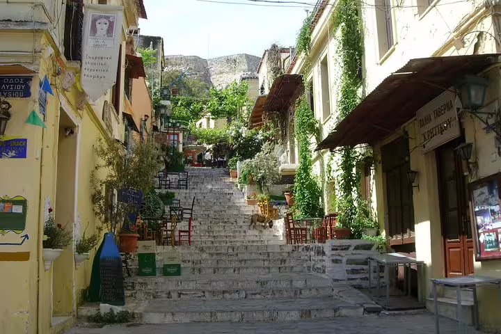 Stone steps in Plaka old town lined with cafés and greenery, a stop on a Best of Athens full-day private tour