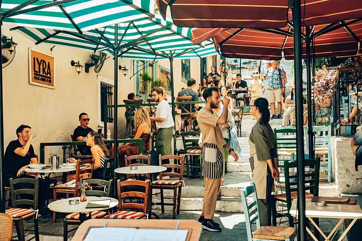 Plaka outdoor taverna scene in Athens, a stop on small group panoramic tour with port pickup