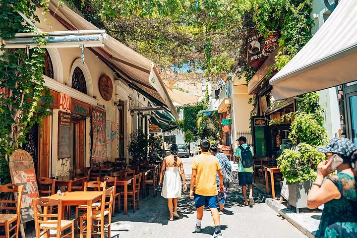 Plaka alley with tavernas and cafés in Athens, small-group walk and taste tour exploring local street food