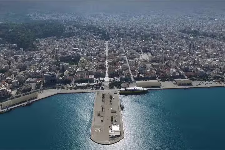 Private chauffeur sedan on coastal highway in Greece, comfortable Athens to Port of Patras private transfer service