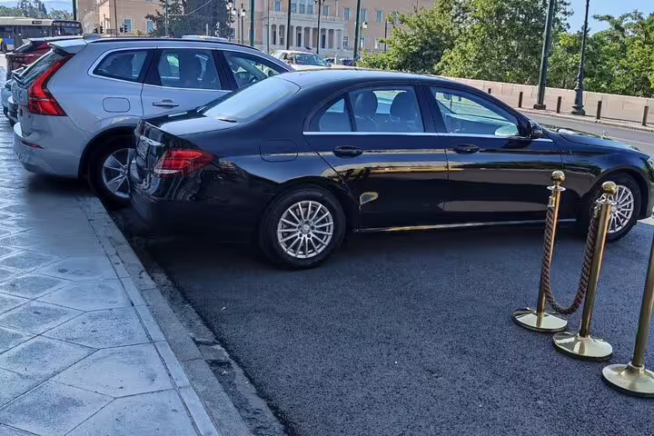 Private car pickup in Athens for Best of Athens half day tour with luxury sedan and SUV at curbside