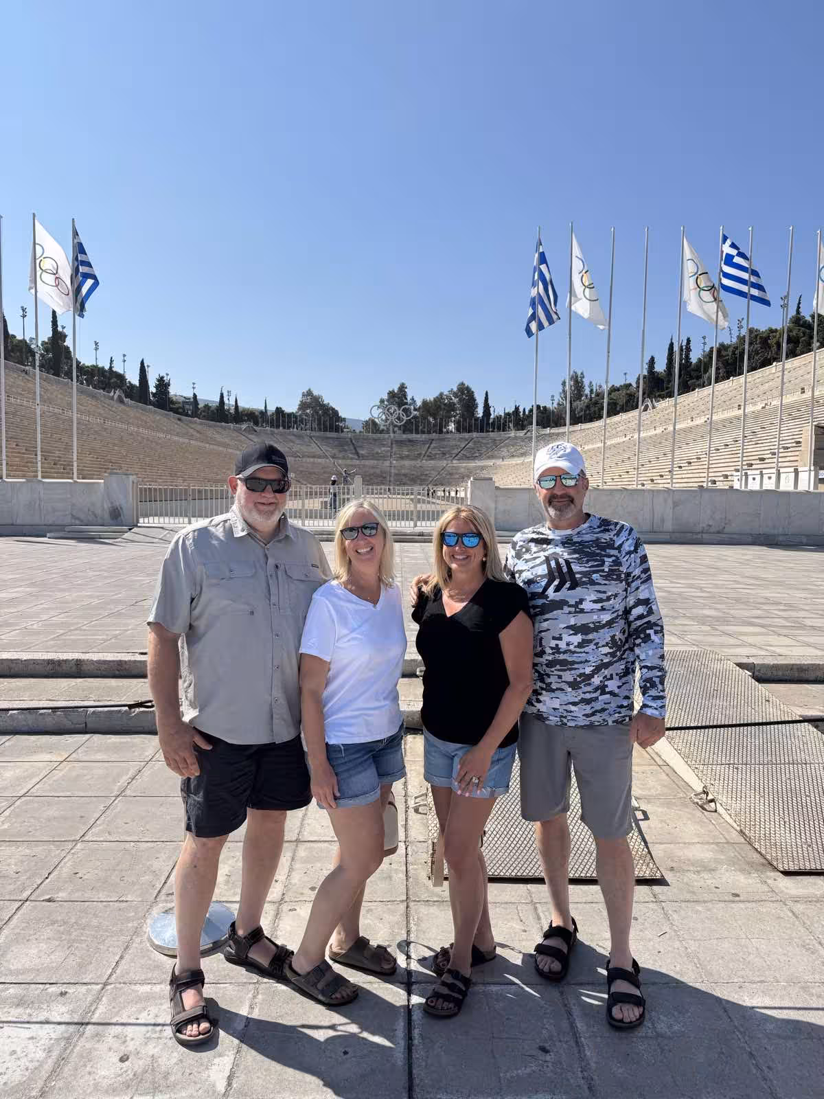 Group photo at Panathenaic Stadium in Athens, a stop on the Best of Athens private car tour with guide