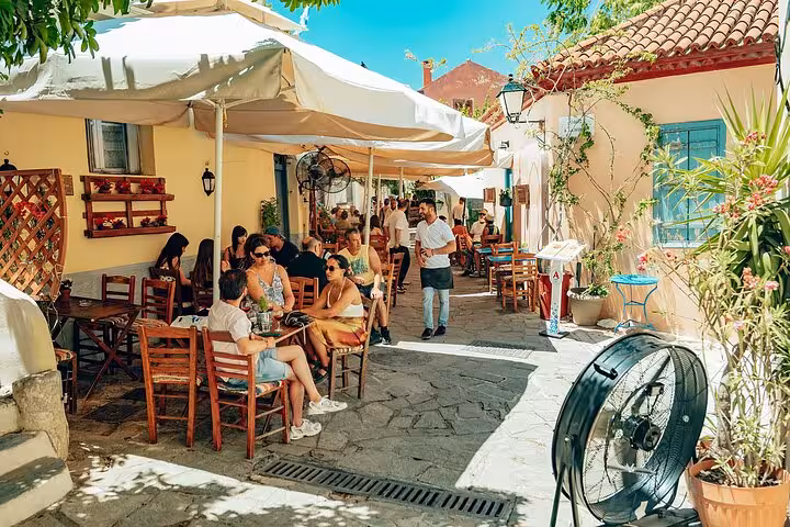 Outdoor taverna stop on small group Athens walk and taste tour, perfect cruise shore excursion in Plaka