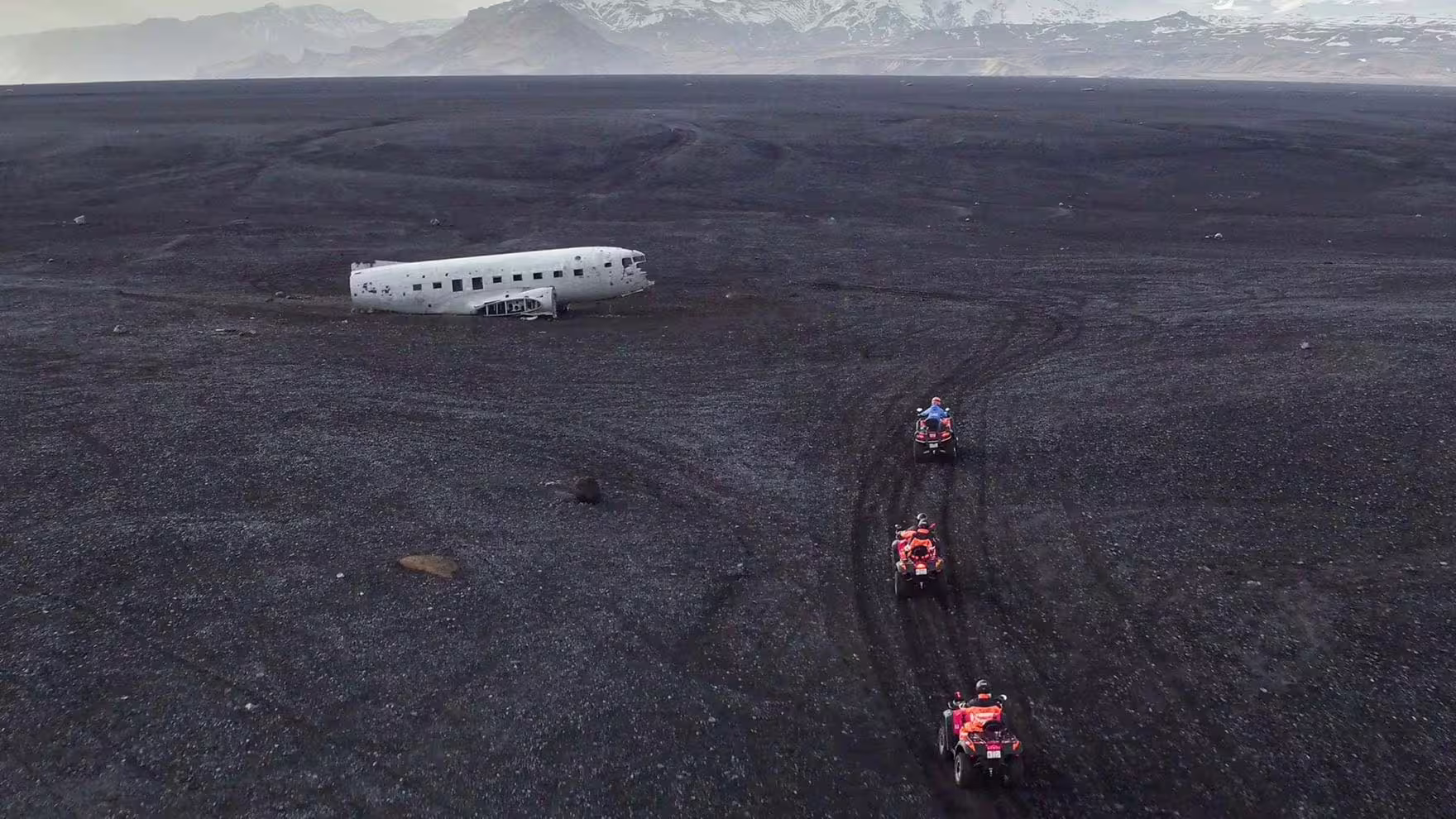 ATV riders cross Iceland black sand to the Sólheimasandur DC-3 plane wreck on a private South Coast tour