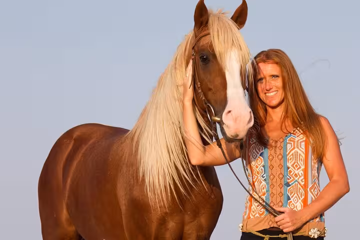 Traveler with horse in Sharm El Sheikh desert, a scenic add-on to sunrise or sunset ATV quad adventure