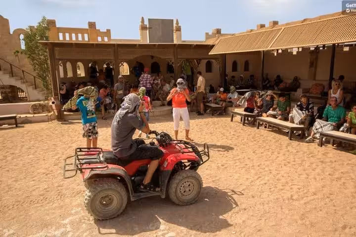 ATV quad bike stop at Bedouin village near Hurghada, Sahl Hasheesh and Makadi Bay desert safari tour
