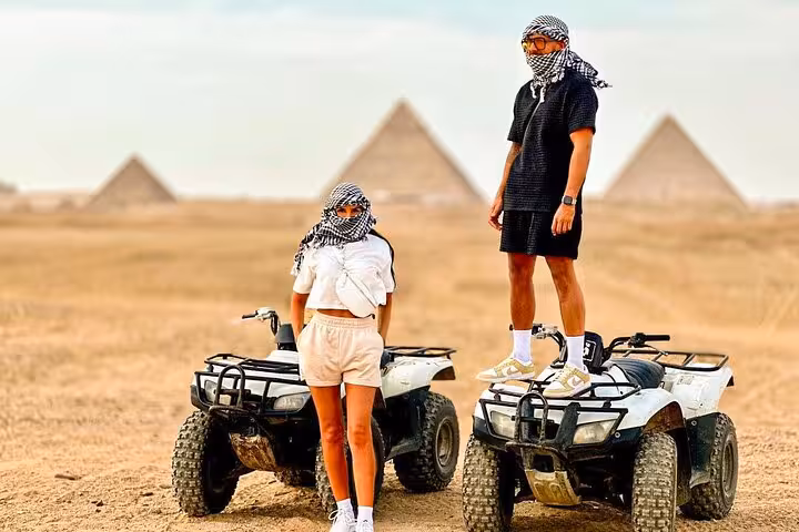 ATV quad bike safari near the Giza Pyramids, Cairo desert adventure tour with riders in keffiyeh scarves