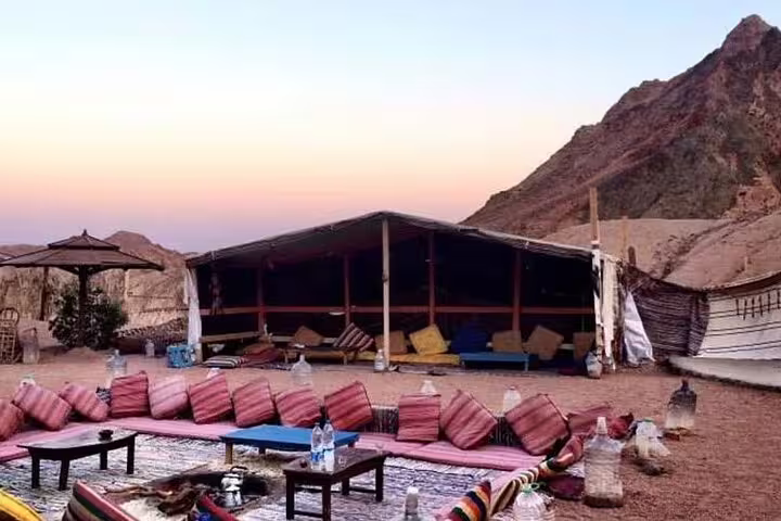 Bedouin desert camp stop on private ATV quad bike safari from Sharm El Sheikh at sunset in Sinai