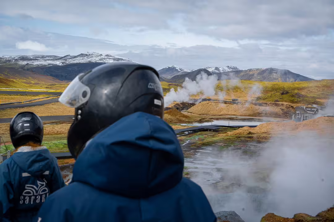 ATV riders explore scenic volcanic springs with steaming vents and snow-capped mountains in a thrilling 3-hour adventure.