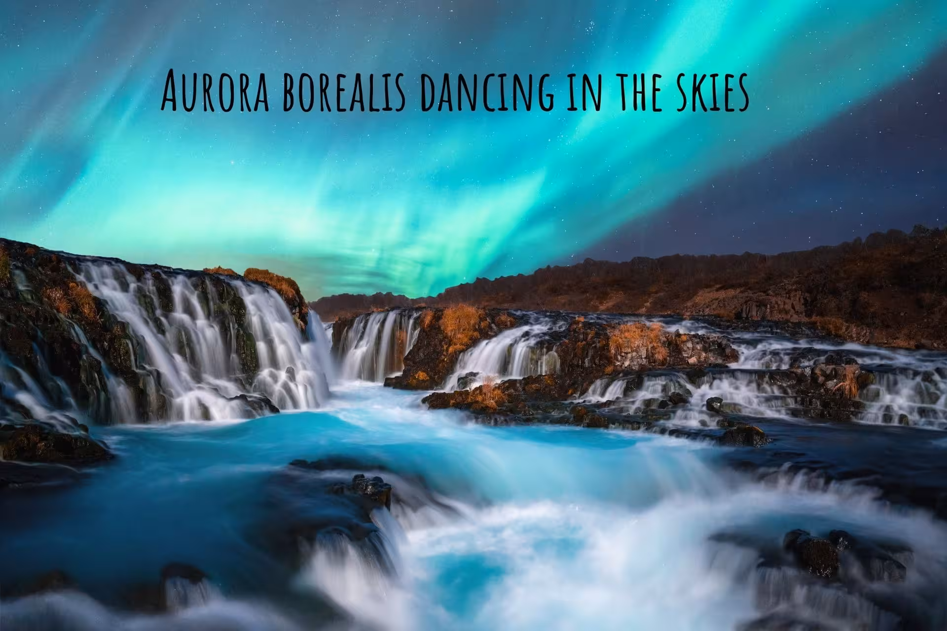 Aurora borealis dancing over cascading waterfalls and turquoise river in South Iceland at night