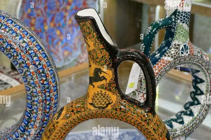 Handmade Avanos ceramic jugs with traditional Cappadocia patterns, ideal souvenir on shopping tour