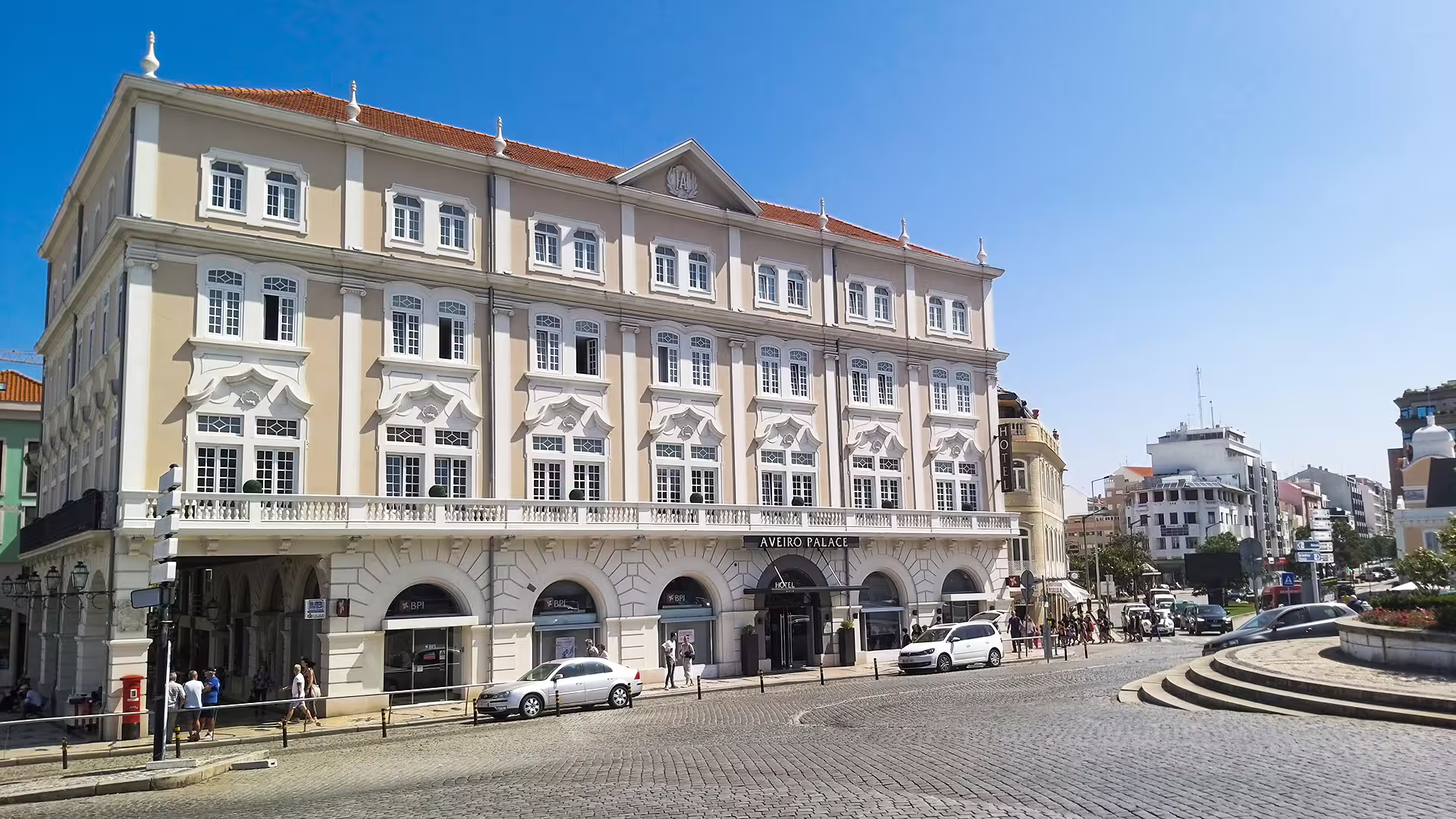Elegant Aveiro Palace hotel facade on a sunny day, featured on the Private Lisbon to Porto Tour for a memorable adventure.