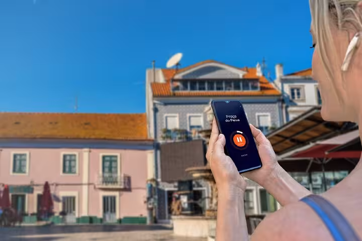 Tourist using audio guide app on smartphone during self-guided walking tour in Aveiro, Portugal